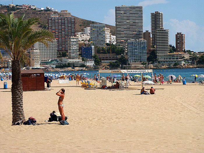 Woman sunbathing on Levante beach in benidorm